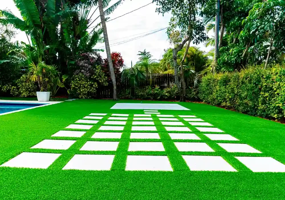 backyard with artificial grass by top turf