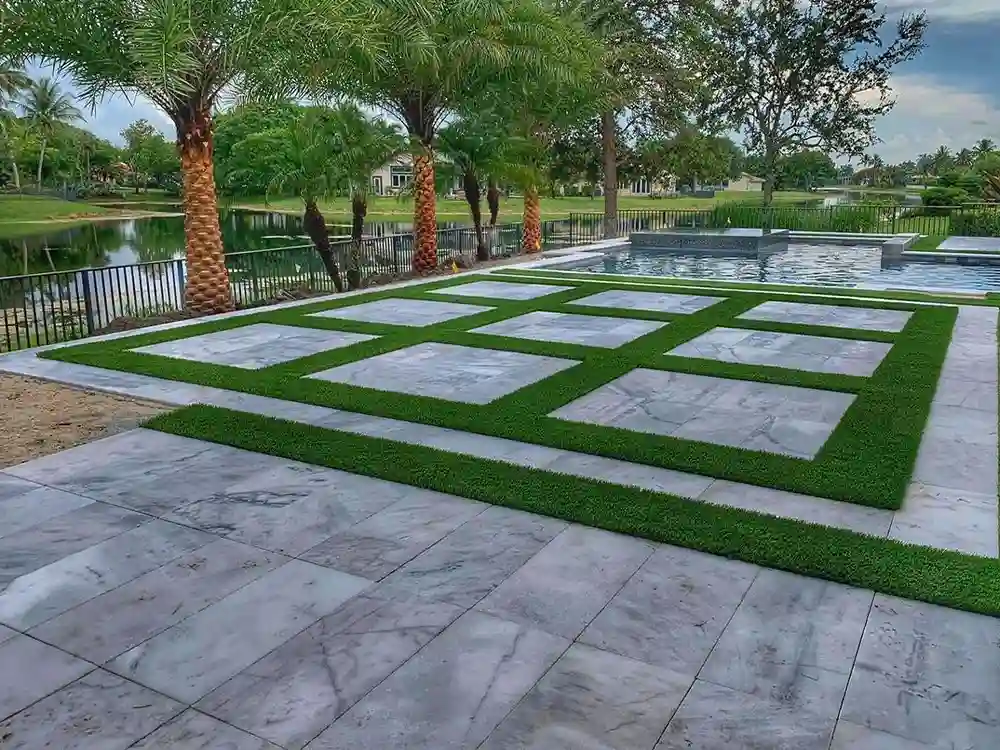 backyard with pool and details of artificial grass by top turf