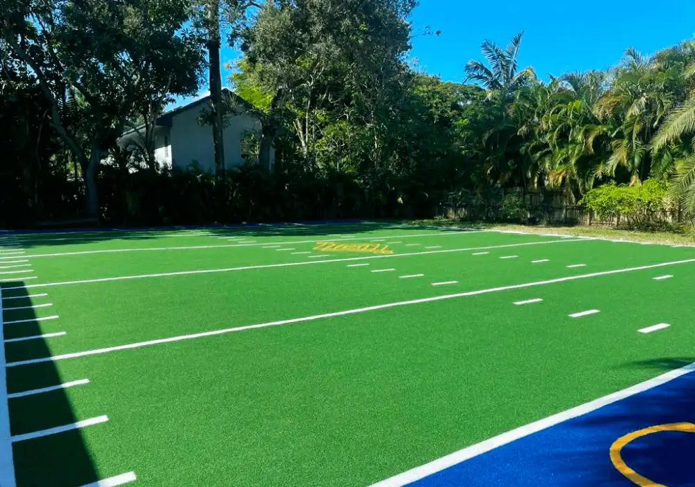 football field with artificial grass by top turf